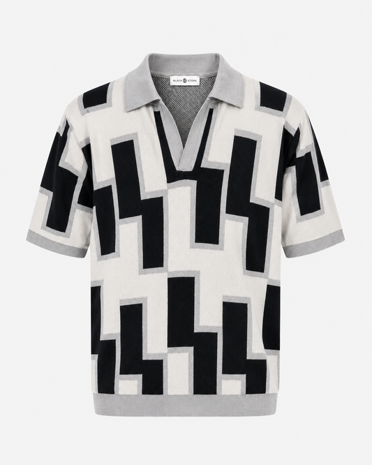 BLACKSTONE Tessellate Knit Polo in Ivory & Black — front view, geometric jacquard pattern with open Johnny collar