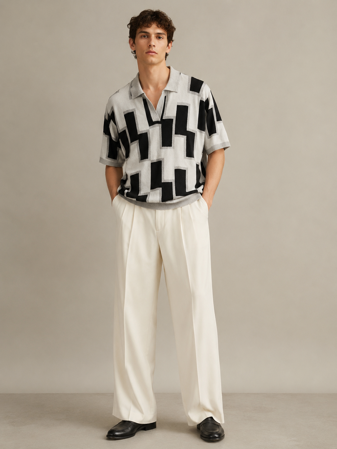 Tessellate Knit Polo — close-up of intarsia jacquard pattern in ivory, black and silver-grey