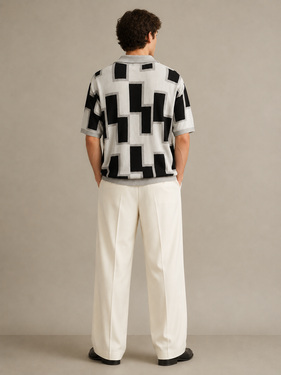 Ivory architectural knit polo full-length styling — open Johnny collar, short sleeves